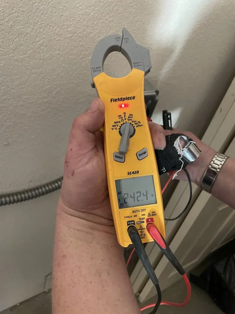 Voltage testing with clamp meter during Generator Installation in San Antonio